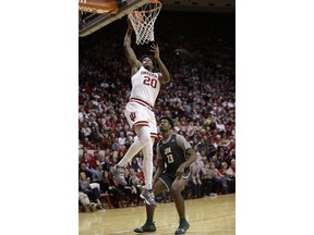 Indiana forward De'Ron Davis (20) dunks in front of Jacksonville guard Tyreese Davis (23) during the second half of an NCAA college basketball game in Bloomington, Ind., Saturday, Dec. 22, 2018. Indiana won 94-64.