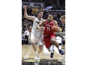 Belmont guard Kevin McClain (11) drives on Purdue guard Ryan Cline (14) during the first half of an NCAA college basketball game in West Lafayette, Ind., Saturday, Dec. 29, 2018.