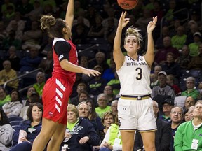 Notre Dame's Marina Mabrey (3) shoots a 3-pointer in front of Western Kentucky's Alexis Brewer during the first half of an NCAA college basketball game Wednesday, Dec. 19, 2018, in South Bend, Ind.