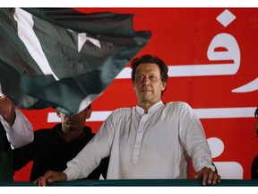 FILE - In this July 21, 2018, file photo, Pakistani politician Imran Khan, chief of Pakistan Tehreek-e-Insaf party, arrives to address an election campaign rally in Islamabad, Pakistan. The Taliban say they are holding "another" meeting on Monday, Dec. 17, 2018 with U.S. officials, this time in the United Arab Emirates and also involving Saudi, Pakistani and Emirati representatives in the latest attempt to bring a negotiated end to Afghanistan's 17-year war.