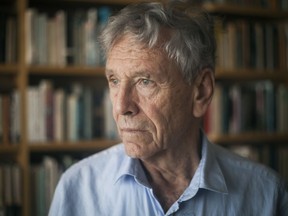 FILE - In this Nov. 4, 2015 file photo, Israeli writer Amos Oz poses for a photo at his house in Tel Aviv, Israel. Israeli media said Friday, Dec. 28, 2018 that Israeli author Amos Oz has died at the age of 79.