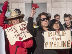 Oil and gas industry supporters gather at a pro-pipeline rally at city hall in Calgary, Alta., Monday, Dec. 17, 2018.THE CANADIAN PRESS/Jeff McIntosh