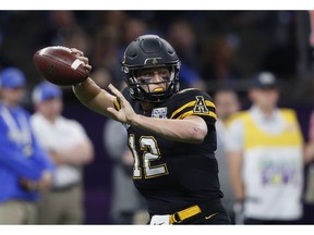 Appalachian State quarterback Zac Thomas (12) passes in the first half of the New Orleans Bowl NCAA college football game against Middle Tennessee in New Orleans, Saturday, Dec. 15, 2018.