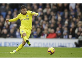 Chelsea's Eden Hazard scores his side's second goal during the English Premier League soccer match between Brighton and Hove Albion and Chelsea at the Amex Stadium in Brighton, England, Sunday, Dec. 16, 2018.