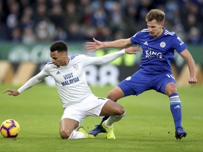 Cardiff City's Josh Murphy, left, and Leicester City's Marc Albrighton in action during their English Premier League soccer match at the King Power Stadium in Leicester, England, Saturday Dec. 29, 2018.