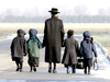Lev Tahor children are walked home from their makeshift school in Chatham, Ontario, in November 2013.