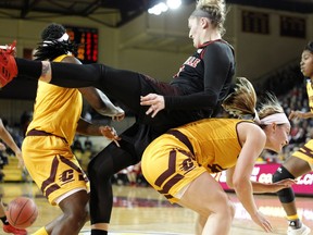 Louisville's Sam Fuehring falls on top of Central Michigan's Maddy Watters during the second quarter of an NCAA college basketball game, Thursday, Dec. 20, 2018, in Mount Pleasant, Mich.