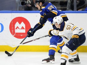 St. Louis Blues' Colton Parayko (55) gets the puck around Buffalo Sabres' Jeff Skinner 53) during the first period of an NHL hockey game, Thursday, Dec. 27, 2018, in St. Louis.