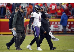 Baltimore Ravens quarterback Lamar Jackson (8) is helped off the field after an injury in overtime of an NFL football game against the Kansas City Chiefs in Kansas City, Mo., Sunday, Dec. 9, 2018.