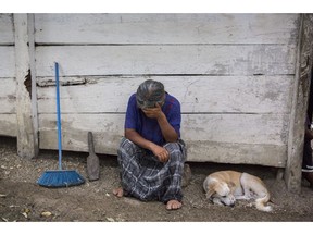 Elvira Choc, 59, Jakelin Amei Rosmery Caal's grandmother, rests her head on her hand in front of her house in Raxruha, Guatemala, on Saturday, Dec. 15, 2018. The 7-year old girl died in a Texas hospital, two days after being taken into custody by border patrol agents in a remote stretch of New Mexico desert.