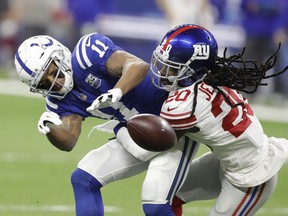 New York Giants cornerback Janoris Jenkins (20) breaks up a pass intended for Indianapolis Colts wide receiver Ryan Grant (11) during the first half of an NFL football game in Indianapolis, Sunday, Dec. 23, 2018.