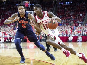 North Carolina State's Markell Johnson (11) drives against Auburn's Chuma Okeke (5) during the first half of an NCAA college basketball game in Raleigh, N.C., Wednesday, Dec. 19, 2018.