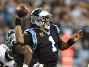 Carolina Panthers' Cam Newton (1) looks to pass against the New Orleans Saints in the first half of an NFL football game in Charlotte, N.C., Monday, Dec. 17, 2018.