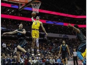 Los Angeles Lakers guard Lonzo Ball (2) dunks against Charlotte Hornets center Cody Zeller, left, in the second half of an NBA basketball game in Charlotte, N.C., Saturday, Dec. 15, 2018.