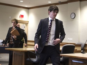 CORRECTS BYLINE TO GEOFF FORESTER, NOT ELIZABETH FRANTZ  - Owen Labrie, followed by his attorney Jaye Rancourt, leaves Merrimack County Superior Court after his amended sentence hearing, Tuesday, Dec. 18, 2018, in Concord, N.H. A judge has refused to shorten the jail term for Labrie, a New Hampshire prep school graduate convicted of sexually assaulting a 15-year-old classmate in 2015, saying he has to report to jail for the remaining 10 months of his sentence the day after Christmas.