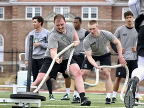 NCAA college football conditioning drills on Memorial Field in Hanover, N.H. Kent State receiver Antwan Dixon, Dartmouth defensive lineman Seth Simmer and Carson-Newman running back Antonio Wimbush are the first recipients of the Mayo Clinic college football Comeback Player of the Year Award. The new award recognizes college football players from FBS, FCS and lower divisions who overcome injury, illness or other challenges to return to the field.