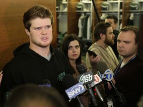 New York Jets quarterback Sam Darnold talks to reporters in the locker room in Florham Park, N.J., Monday, Dec. 31, 2018. The search for a new coach has begun for the New York Jets. After firing Todd Bowles on Sunday night, the team is focused on bringing in someone who will be able to lead a franchise that has missed the playoffs for eight straight seasons but has a promising young quarterback in Darnold and expects to be busy in free agency this offseason.