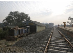 In this Nov. 29, 2018 photo, an old train engine is seen next to the newly built train tracks connecting the 34 kilometers (21 miles) between Janakpur in southeastern Nepal and Jay Nagar in the Indian state of Bihar at Janakpur in Nepal. The competition between two Asian giants, India and China, for influence over tiny Nepal is yielding a bonanza in the form of the Himalayan mountain nation's first modern railway, and possibly more to come.