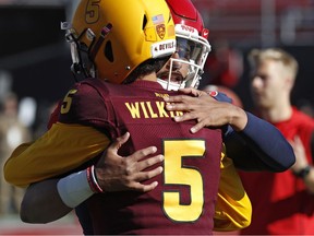 Fresno State quarterback Marcus McMaryion, right, embraces Arizona State quarterback Manny Wilkins (5) before the Las Vegas Bowl NCAA college football game, Saturday, Dec. 15, 2018, in Las Vegas.