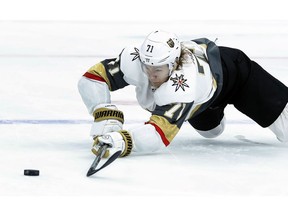 FILE - In this Nov. 1, 2018, file photo, Vegas Golden Knights' William Karlsson, of Sweden, reaches for a loose puck during the first period of an NHL hockey game against the St. Louis Blues, in St. Louis. Hindsight is 43/35 for the Columbus Blue Jackets. That's how many goals and assists William Karlsson put up for the Vegas Golden Knights after the Blue Jackets let him go in the expansion draft.