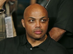 FILE - In this May 2, 2015, file photo, Charles Barkley joins the crowd before the start of the world welterweight championship bout between Floyd Mayweather Jr. and Manny Pacquiao in Las Vegas. A chance meeting in a hotel lobby sparked an unlikely friendship between former NBA star Charles Barkley and a cat litter scientist in Iowa. The story has been shared widely since it was told last week by the scientist's daughter on "Only A Game," an NPR sports show produced by Boston-based WBUR. Shirley Wang says that her father, Lin Wang, approached Barkley at a hotel while on a business trip. The two began talking, got dinner and exchanged numbers. They would meet up over the years to watch basketball games or hang out on the set of Barkley's show. When Lin Wang died this year, Barkley showed up at his funeral in Iowa to the surprise of other attendees.