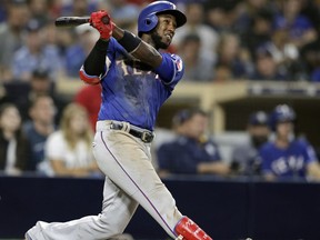 FILE - In this Sept. 14, 2018, file photo, Texas Rangers' Jurickson Profar watches his two-run home run against the San Diego Padres during the seventh inning of a baseball game in San Diego. Texas traded infielder Jurickson Profar to the Oakland Athletics on Friday, Dec. 21, 2018, in a three-team team that included Tampa Bay and netted the Rangers four prospects.