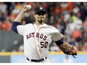 FILE - In this Wednesday, Oct. 17, 2018 file photo, Houston Astros starting pitcher Charlie Morton throws against the Boston Red Sox during the first inning in Game 4 of a baseball American League Championship Series in Houston. A person familiar with the agreement tells The Associated Press that All-Star pitcher Charlie Morton and the Tampa Bay Rays have reached a $30 million, two-year deal. The person spoke on condition of anonymity Wednesday, Dec. 12, 2018 because the contract has not been officially announced.