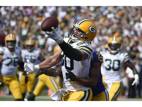 FILE - In this Oct. 28, 2018, file photo, Green Bay Packers tight end Jimmy Graham (80) can't make the catch as Los Angeles Rams cornerback Marcus Peters (22) defends during the first half of an NFL football game, in Los Angeles. Whether it was earlier in his career at New Orleans or the past few seasons in Seattle, two things were common for tight end Jimmy Graham: production and victories. Both are in short supply in his first season with the Green Bay Packers. My numbers suck," Graham said Friday, Dec. 14, 2018.
