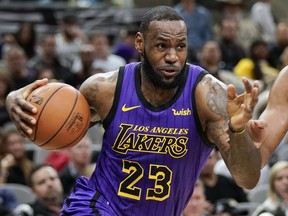 FILE - In this Dec. 7, 2018, file photo, Los Angeles Lakers' LeBron James (23) drives against the San Antonio Spurs during the first half of an NBA basketball game, in San Antonio. LeBron James was named The Associated Press Male Athlete of the Year on Thursday, Dec. 27, 2018.
