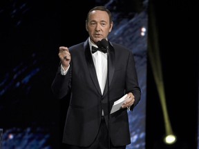 FILE - In this Oct. 27, 2017, file photo, Kevin Spacey presents an award in Beverly Hills, Calif. A Massachusetts prosecutor says Spacey is scheduled to be arraigned Jan. 7, 2019, on a charge of indecent assault and battery for allegedly sexually assaulting the teenage son of a Boston television anchor in a Nantucket restaurant.