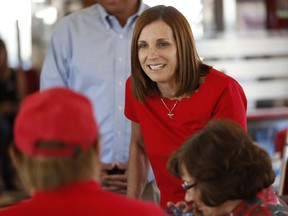FILE - In this Nov. 6, 2018, file photo, Arizona Republican senatorial candidate Martha McSally, speaks with voters, at Chase's diner in Chandler, Ariz. Arizona's governor has named McSally to replace U.S. Sen. Jon Kyl in the U.S. Senate seat that belonged to Sen. John McCain. Republican Gov. Doug Ducey announced Tuesday, Dec. 18, that McSally will take over after Kyl's resignation becomes effective Dec. 31. McSally lost the Senate race to Democratic Rep. Kyrsten Sinema.