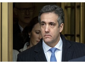 Michael Cohen, President Donald Trump's former lawyer, leaves federal court after his sentencing in New York, Wednesday, Dec. 12, 2018. Cohen was sentenced Wednesday to three years in prison for an array of crimes that included arranging the payment of hush money to two women that he says was done at the direction of Trump.