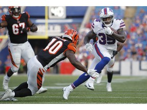 FILE - In this Aug. 26, 2018, file photo, Buffalo Bills running back Keith Ford (35) rushes past Cincinnati Bengals' Brandon Wilson (40) during the second half of a preseason NFL football game in Orchard Park, N.Y. The Bills have promoted Ford from their practice squad to provide insurance with starter LeSean McCoy and backup Chris Ivory nursing injuries.