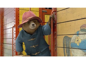 This image released by Warner Bros. Pictures shows the character Paddington, voiced by Ben Whishaw, in a scene from "Paddington 2."  (Warner Bros. Pictures via AP)
