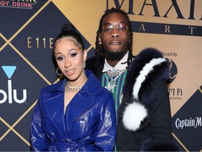 FILE- In this Feb. 3, 2018, file photo, Cardi B, left, and Offset arrive at the Maxim Super Bowl Party at the Maxim Dome in Minneapolis. Cardi B is asking the public to not bash Offset, who became the target of internet outrage after he interrupted her set at the Rolling Loud Festival in Los Angeles Saturday night, Dec. 15, 2018 and asked her to get back together with him.