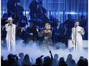 FILE - In this Nov. 14, 2018 file photo, Brian Kelley, left, and Tyler Hubbard, right, of Florida Georgia Line perform "Meant to Be" with Bebe Rexha at the 52nd annual CMA Awards in Nashville, Tenn. The two are nominated for a Grammy Award with pop singer Bebe Rexha for best country duo/group performance for their chart busting hit of the year.