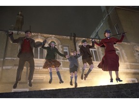 This image released by Disney shows, from left, Lin-Manuel Miranda, Pixie Davies, Joel Dawson, Nathanael Saleh and Emily Blunt in "Mary Poppins Returns."
