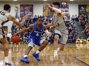 Buffalo guard Davonta Jordan (4) drives against Canisius guard Isaiah Reese (13) during the first half of an NCAA college Basketball game, Saturday, Dec. 29, 2018, in Buffalo N.Y.