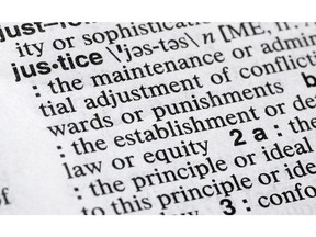 In this Dec. 12, 2018, photo, "justice" is displayed in a Merriam-Webster dictionary in New York. Merriam-Webster has chosen "justice" as its 2018 word of the year, driven by the churning news cycle and President Trump's Twitter feed.