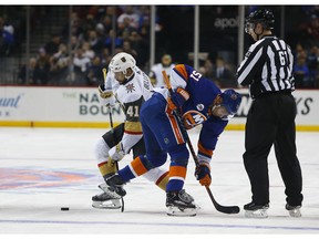 Vegas Golden Knights center Pierre-Edouard Bellemare (41) and New York Islanders center Valtteri Filppula (51) battle for the puck after a face off during the first period of an NHL hockey game, Wednesday, Dec.12, 2018, in New York.