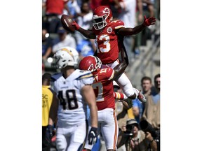 FILE - In this Sunday, Sept. 9, 2018, file photo, Kansas City Chiefs wide receiver De'Anthony Thomas celebrates after scoring with wide receiver Chris Conley during the second half of an NFL football game against the Los Angeles Chargers in Carson, Calif. The Kansas City Chiefs are missing their star running back, likely without his backup and could have their top two wide receivers hobbled or shelved for their crucial AFC West showdown against the Los Angeles Chargers on Thursday, Dec. 13.