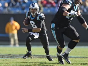 File-This file  photo taken Dec. 23, 2018, shows Carolina Panthers' Taylor Heinicke (6) running against the Atlanta Falcons during the first half of an NFL football game in Charlotte, N.C. The Panthers placed Heinicke on injured reserve Wednesday, Dec. 26, 2018, with an elbow injury.