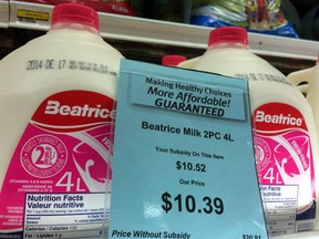 A price tag lists the price and subsidy of a 4-litre jug of milk at a grocery store in Iqaluit, Nunavut on December 8, 2014. Talks to reform a subsidy program to make food more affordable for northern families appear to have stalled over concerns from Inuit.