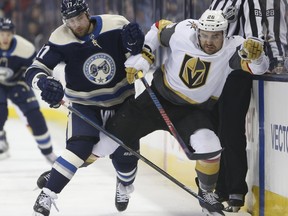 Columbus Blue Jackets' Brandon Dubinsky, left, and Vegas Golden Knights' Paul Stastny chase a loose puck during the first period of an NHL hockey game Monday, Dec. 17, 2018, in Columbus, Ohio.