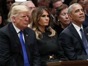 President Donald Trump, first lady Melania Trump and former President Barack Obama listen as former Canadian Prime Minister Brian Mulroney speaks during the state funeral for former U.S. President George H. W. Bush at the Washington National Cathedral on December 5, 2018 in Washington, DC.