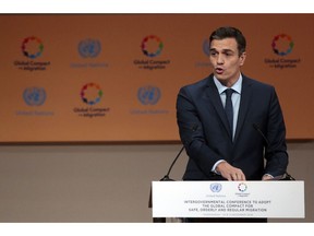Spain's Prime Minister Pedro Sanchez addresses delegates during the opening session of a UN Migration Conference in Marrakech, Morocco, Monday, Dec.10, 2018. Top U.N. officials and government leaders from about 150 countries are uniting around an agreement on migration, while finding themselves on the defensive about the non-binding deal amid criticism and a walkout from the United States and some other countries.