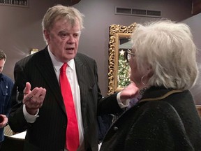 In this Sunday, Dec. 16, 2018, former "A Prairie Home Companion" host Garrison Keillor talks to fans after his performances at Crooners lounge in Fridley, Minn. Keillor is stepping back into the spotlight a year after Minnesota Public Radio cut ties with him over a sexual misconduct allegation. Keillor performed two sold-out shows Sunday night at Crooners, a jazz nightclub in a Minneapolis suburb near where he grew up. Fans laughed, applauded and sang along.