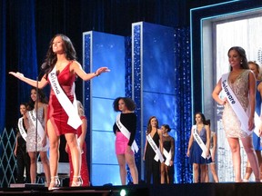 In this Sept. 7, 2018 photo, Miss Arizona Isabel Ticlo introduces herself at the start of the third and final; night of preliminary competition at the Miss America competition in Atlantic City N.J. As it nears the 100th anniversary of the pageant, the Miss America Organization is seeking expressions of interest in hosting the competition from other cities.