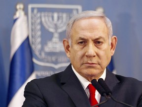 In this Nov. 18, 2018 file photo, Israeli Prime Minister Benjamin Netanyahu delivers a statement in Tel Aviv, Israel.