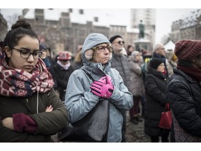 Residents react during a gathering in a central square of the eastern French city of Strasbourg, Sunday Dec.16, 2018 to pay homage to the victims of a gunman who killed four people and wounded a dozen more. The gathering was held in Kleber Square by a Christmas market and near where the gunman opened fire last Tuesday evening.